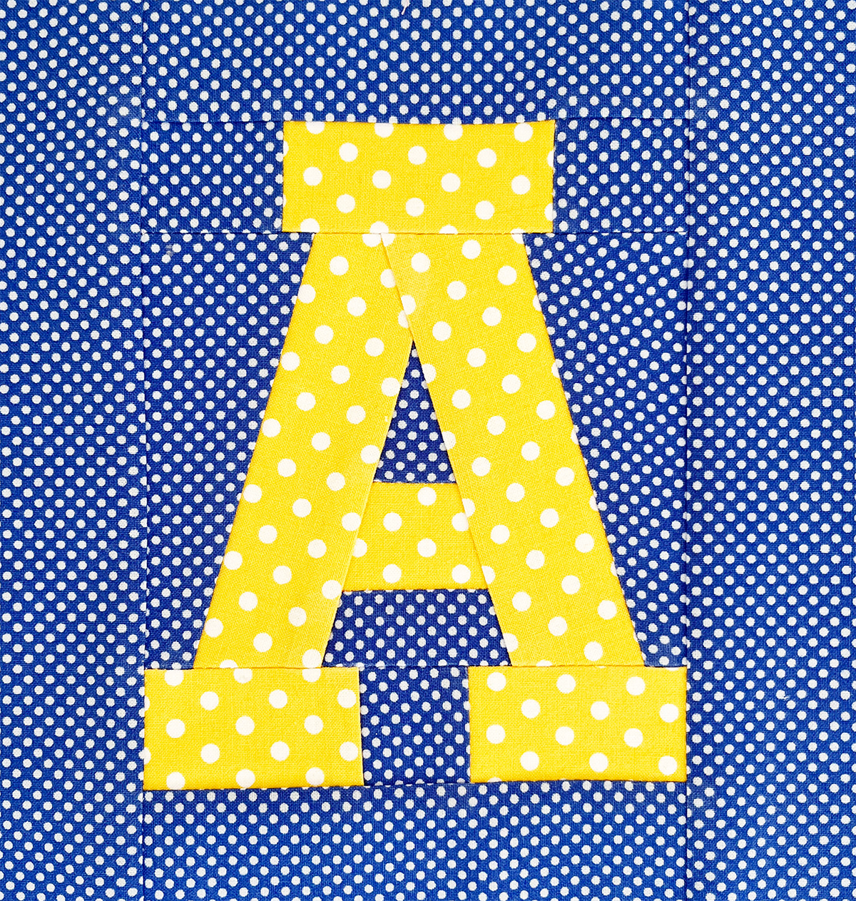Varsity letter A quilt block in yellow and blue school colors